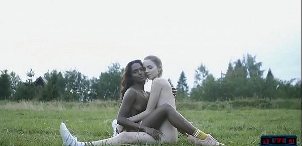 Dark and white chocolate lesbian play in the outdoors